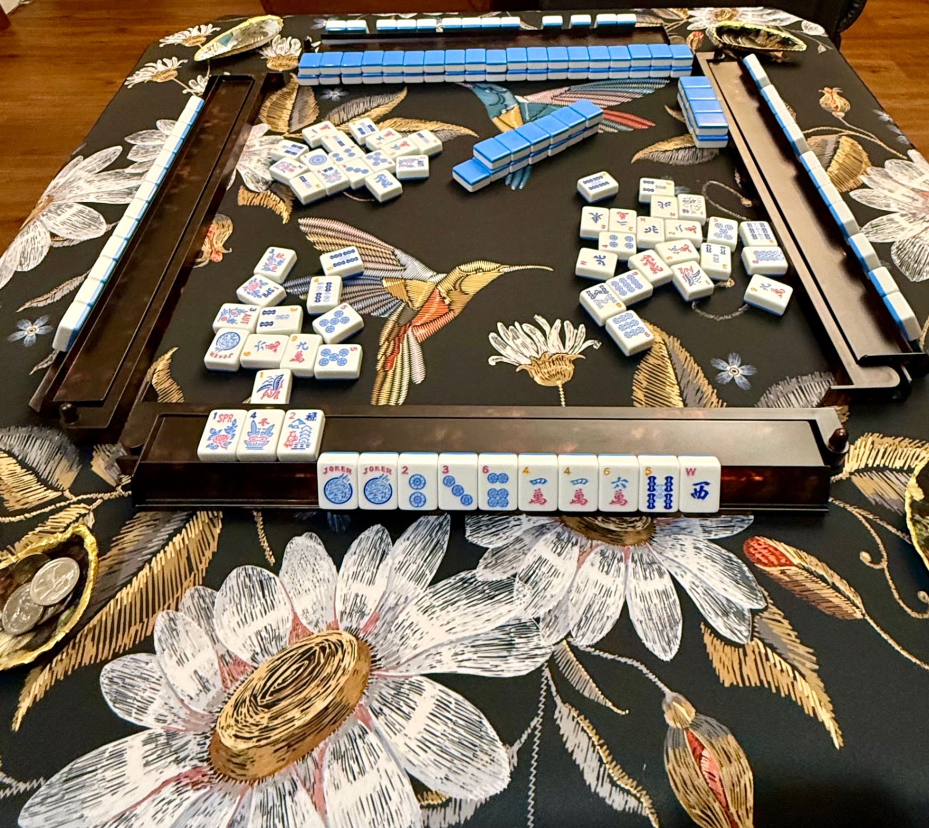 Mahjong set on embroidered table