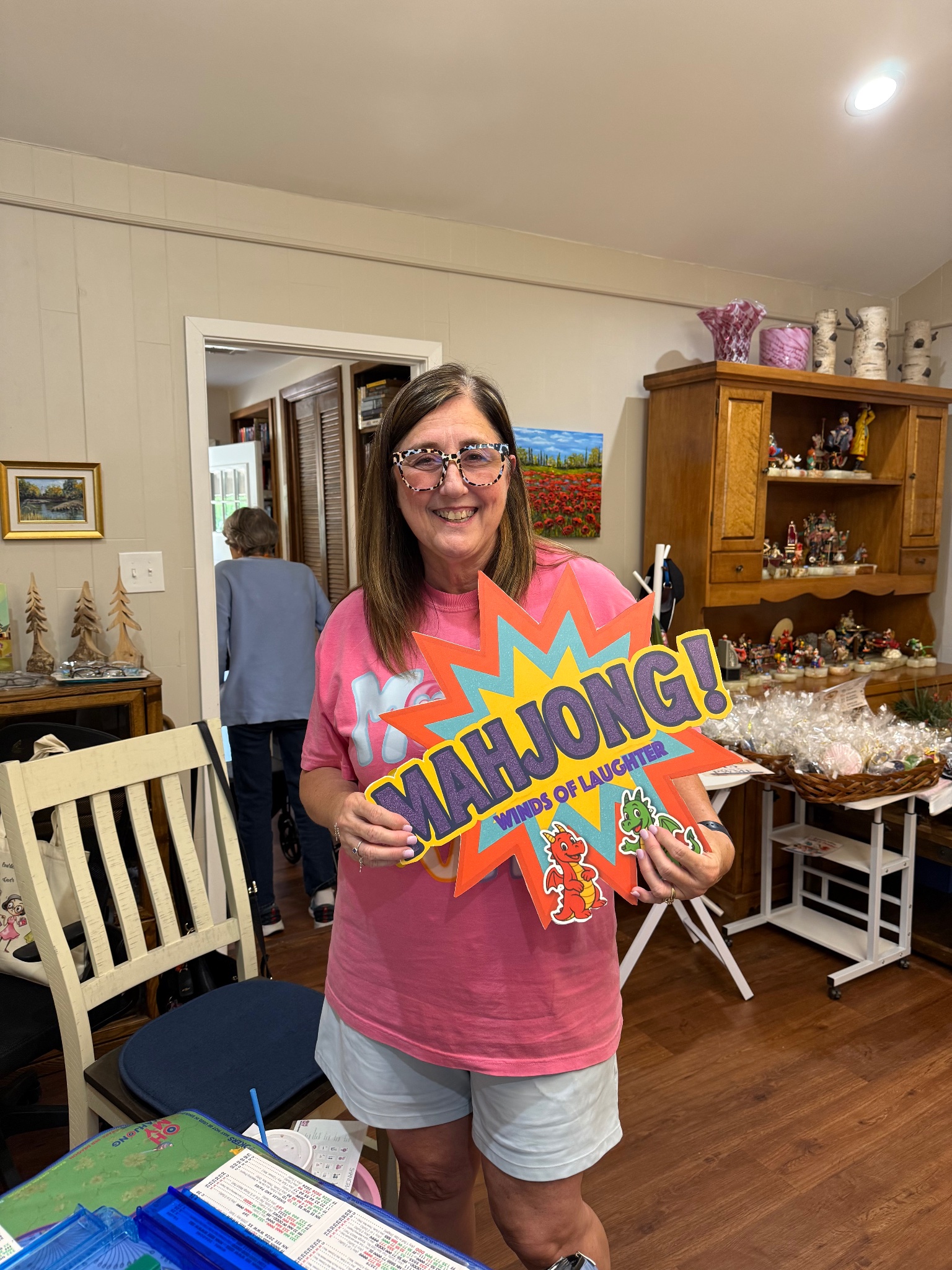 Player holding Winds of Laughter sign